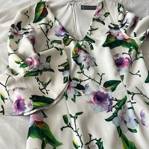 Size 12 Dress white background with green and purple flowers. Is a beautiful